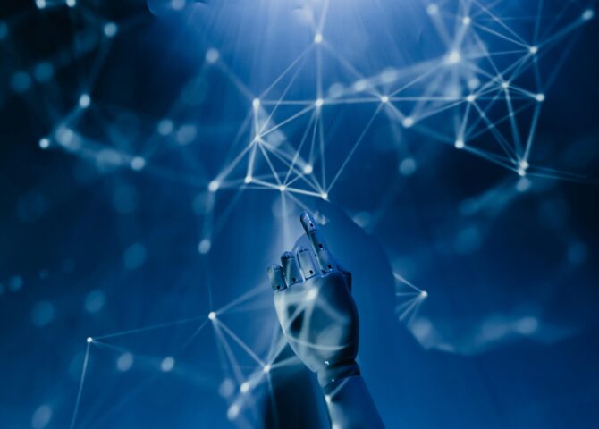 Free A robotic hand reaching into a digital network on a blue background, symbolizing AI technology. Stock Photo