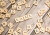 scrabble-letters-spelling-saas-on-a-wooden-tabl