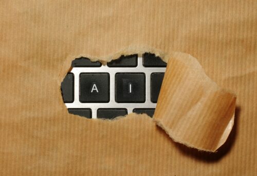 A piece of cardboard with a keyboard appearing through it