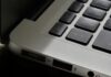 Free Detailed view of a silver laptop showing keyboard and multiple ports. Stock Photo