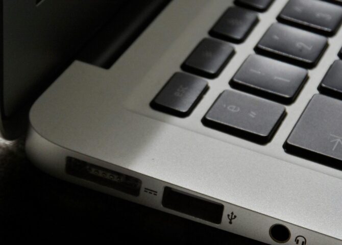 Free Detailed view of a silver laptop showing keyboard and multiple ports. Stock Photo