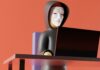 hacker typing on a laptop lego style